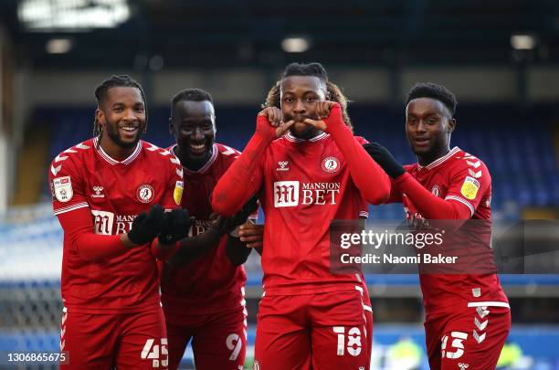 Kasey Palmer of Bristol City celebrates with teammates Famara Diedhiou, Antoine Semenyo and Steven Sessegnon after scoring his team's first goal...