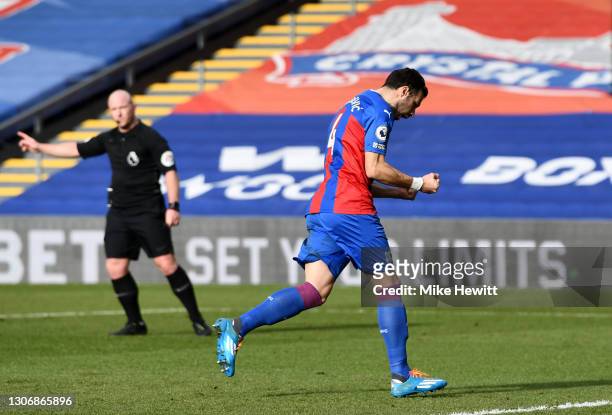 Luka Milivojevic of Crystal Palace celebrates after scoring their team's first goal from the penalty spot during the Premier League match between...