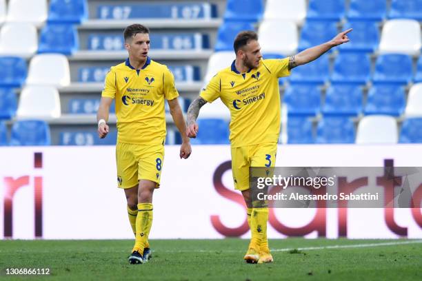 Federico Dimarco of Hellas Verona F.C. Celebrates after scoring their team's second goal with teammate Darko Lazovic during the Serie A match between...