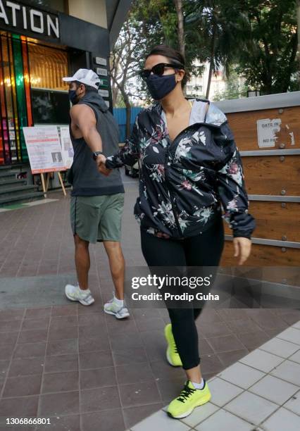 Angad Bedi and Neha Dhupia are seen at Khar on March 13, 2021 in Mumbai, India