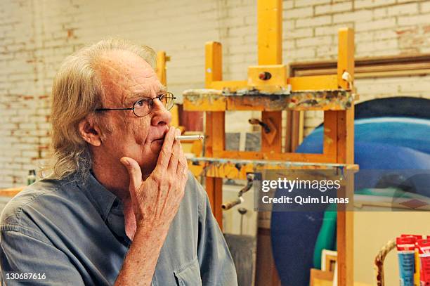 Spanish painter and singer Luis Eduardo Aute poses in his studio before the presentation of 'Giraluna' a book illustrated by him and based on his own...