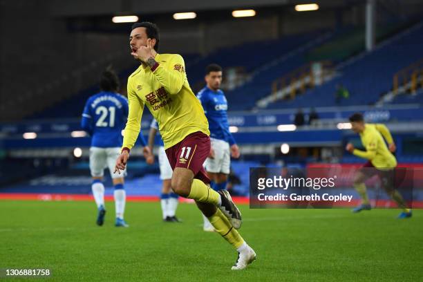 Dwight McNeil of Burnley celebrates after scoring their team's second goal during the Premier League match between Everton and Burnley at Goodison...