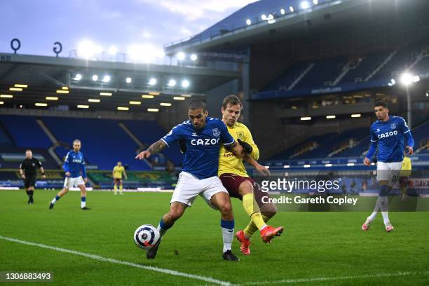 Allan of Everton battles for possession with Matej Vydra of Burnley during the Premier League match between Everton and Burnley at Goodison Park on...