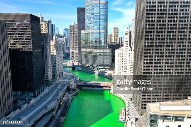 An aerial picture shot with a drone shows the Chicago River as it flows through downtown after it was dyed green in celebration of St. Patrick's Day...