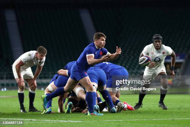 Antoine Dupont of France passes the ball out the ruck during the Guinness Six Nations match between England and France at Twickenham Stadium on March...