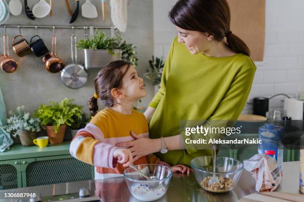 making healthy breakfast with my mommy - muesli stock pictures, royalty-free photos & images