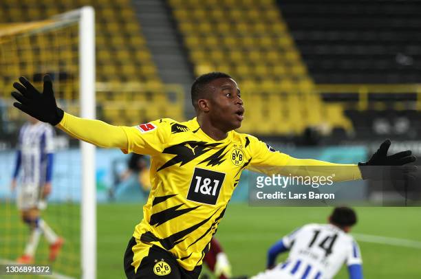 Youssoufa Moukoko of Borussia Dortmund celebrates after scoring their team's second goal during the Bundesliga match between Borussia Dortmund and...