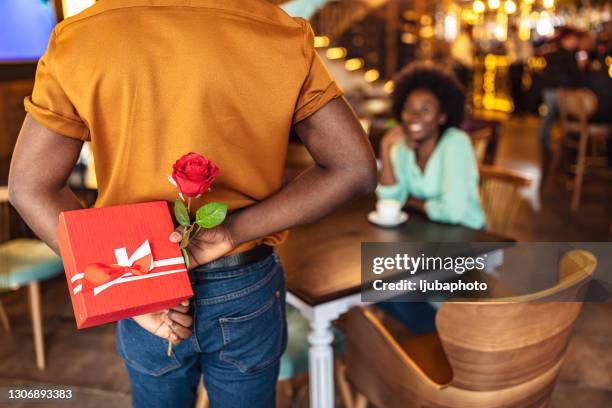 romantic surprise in the restaurant - hiding behind back stock pictures, royalty-free photos & images