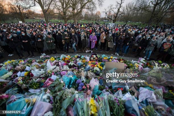 Thousands of people attend a vigil at Clapham Common bandstand to pay their respects and lay flowers in memory of Sarah Everard on March 13, 2021 in...