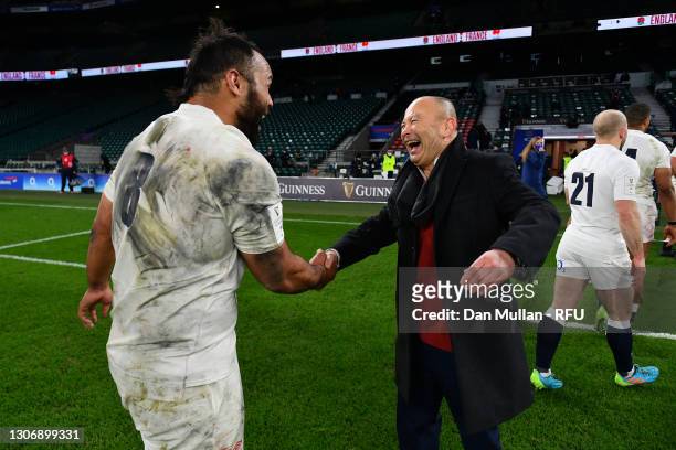Billy Vunipola of England celebrates with Eddie Jones, Head Coach of England following their victory during the Guinness Six Nations match between...