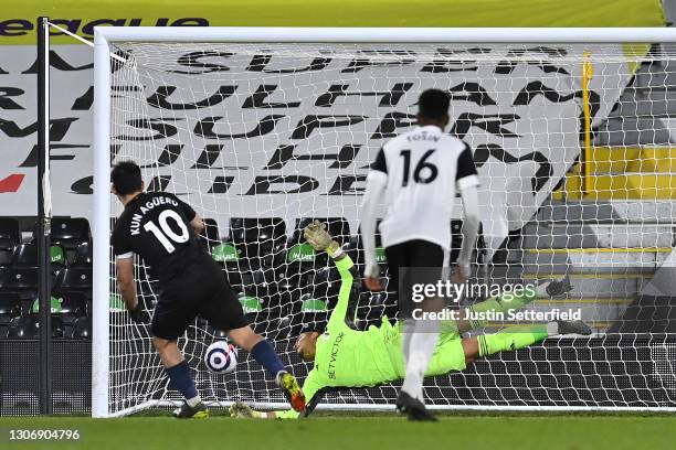 Sergio Aguero of Manchester City scores their team's third goal from the penalty spot during the Premier League match between Fulham and Manchester...