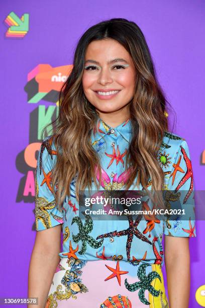 In this image released on March 13, Miranda Cosgrove attends Nickelodeon's Kids' Choice Awards at Barker Hangar on March 13, 2021 in Santa Monica,...