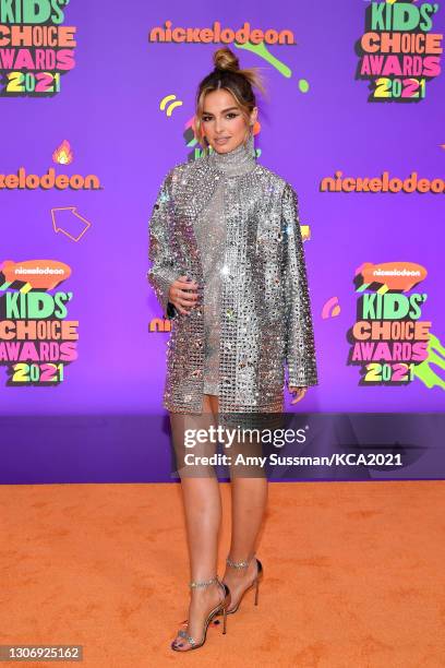 In this image released on March 13, Addison Rae attends Nickelodeon's Kids' Choice Awards at Barker Hangar on March 13, 2021 in Santa Monica,...