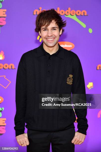 In this image released on March 13, David Dobrik attends Nickelodeon's Kids' Choice Awards at Barker Hangar on March 13, 2021 in Santa Monica,...