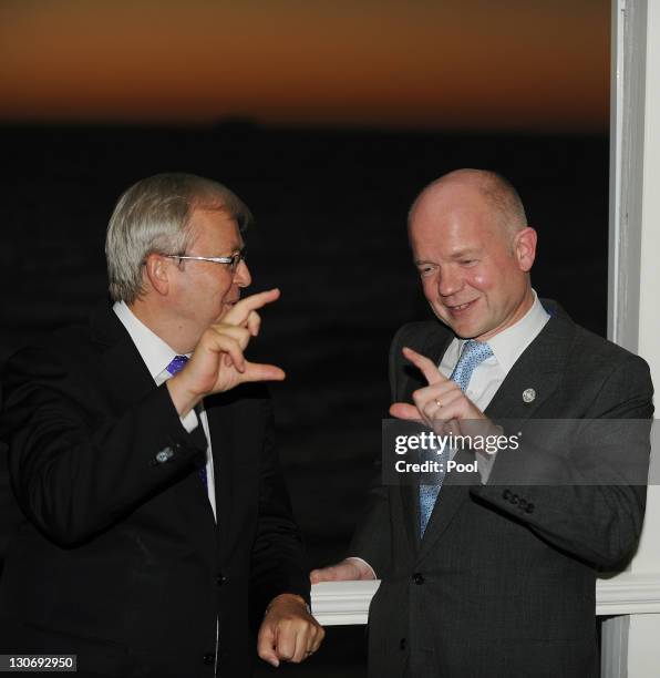 S Foreign Minister William Hague speaks with Australia's Foreign Minister Kevin Rudd at a reception at Cottesloe Beach during the Commonwealth Heads...