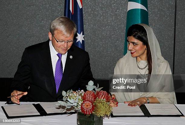 Australia's Foreign Minister Kevin Rudd and Pakistan's Foreign Minister Hina Rabbani Khar sign a Memorandum of Understanding at a bilateral meeting...