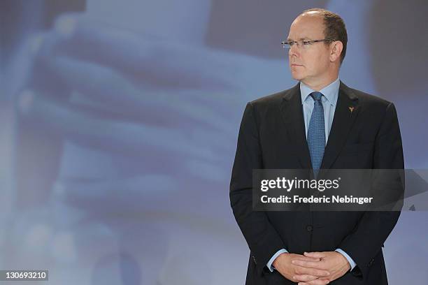 Prince Albert II of Monaco pose for pictures during the flag ceremony for Sochi olympic games 2014 at the Peace & Sport 5th International Forum at...