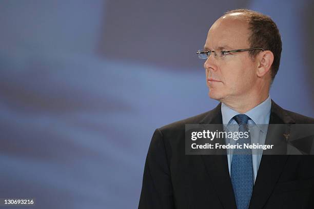 Prince Albert II of Monaco pose for pictures during the flag ceremony for Sochi olympic games 2014 at the Peace & Sport 5th International Forum at...