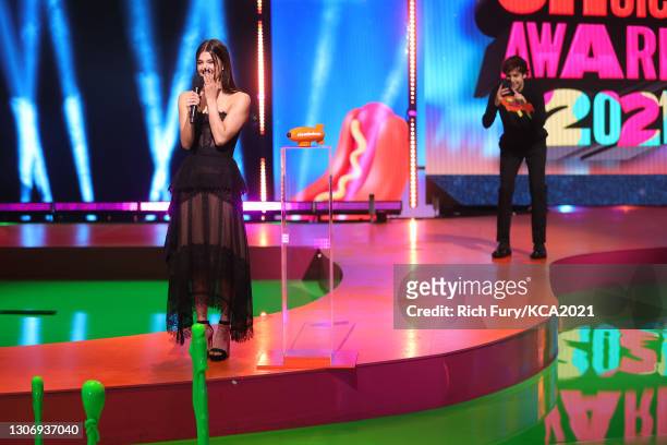 In this image released on March 13, Favorite Female Social Star Charli D'Amelio and David Dobrik speak onstage during Nickelodeon's Kids' Choice...