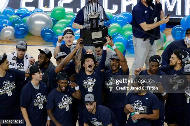 The Georgia Tech Yellow Jackets celebrate defeating the Florida State Seminoles in the ACC Men's Basketball Tournament championship game at...