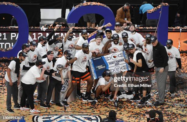 The Oregon State Beavers celebrate their 70-68 victory over the Colorado Buffaloes to win the championship game of the Pac-12 Conference basketball...