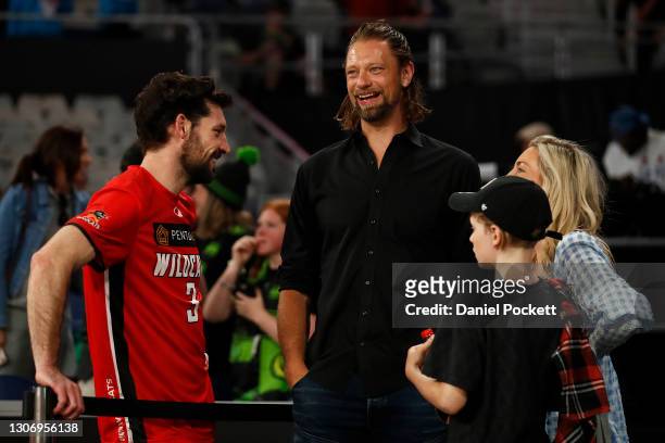 Kevin White of the Wildcats speaks with former NBL player David Andersen ahead of the NBL Cup match between the Perth Wildcats and the Adelaide 36ers...