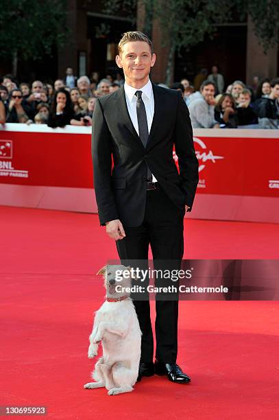 Actor Jamie Bell and dog Milou attend the "The Adventures Of Tin Tin" premiere during the 6th International Rome Film Festival on October 28, 2011 in...