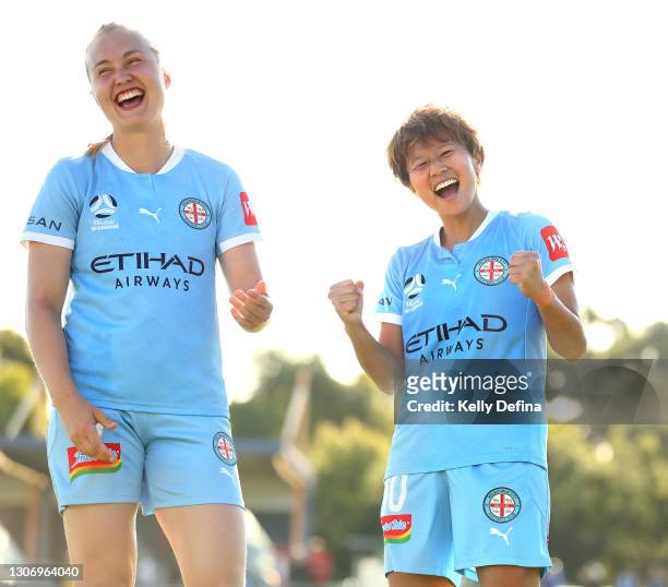Chinatsu Kira of Melbourne City and Noor Hoelsbrekken Eckhoff of Melbourne City celebrate victory after the round 12 W-League match between Melbourne...