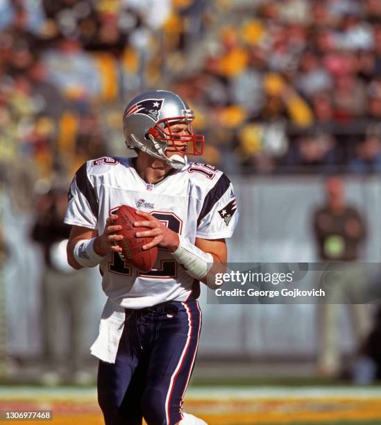 Quarterback Tom Brady of the New England Patriots looks to pass against the Pittsburgh Steelers during the 2001 season AFC Championship game at Heinz...