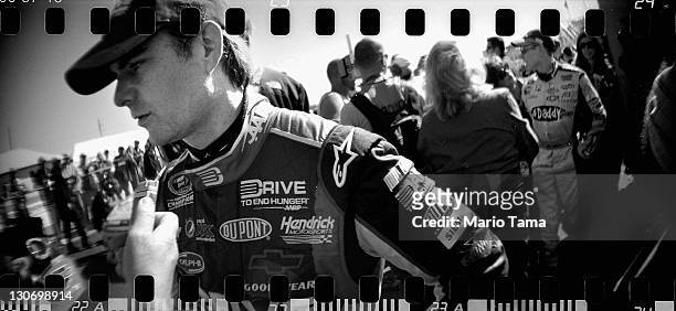 Drivers Jeff Gordon and Mark Martin look on after a practice run for the NASCAR Sprint Cup Series Good Sam Club 500 at Talladega Superspeedway on...