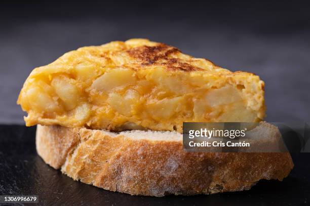 typical spanish pincho de tortilla de patatas - spanish culture fotografías e imágenes de stock
