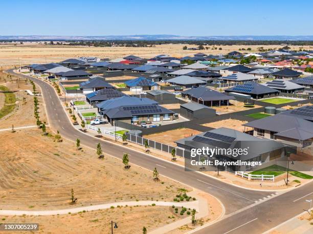 aerial view, new rural housing development being built on former quality food-producing farmland. - solar panel home stock pictures, royalty-free photos & images