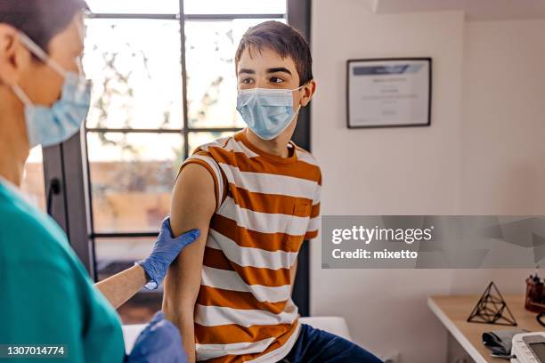 will it hurt me - boy exam stock pictures, royalty-free photos & images