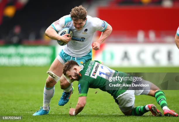 Theo Brophy Clews of London Irish takes a hit to the face as he tackles Ted Hill of Worcester Warriors during the Gallagher Premiership Rugby match...