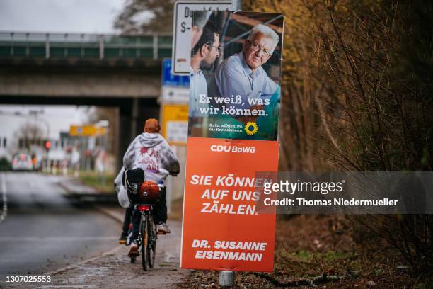 Election posters of Winfried Kretschmann, premier of Baden-Wuerttemberg and member of the German Greens Party and Susanne Eisenmann, lead candidate...