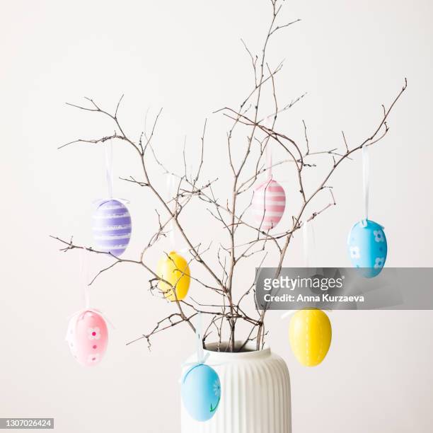 easter egg tree with painted easter eggs on white background. isolated on white. image with copy space. - spotted egg stock pictures, royalty-free photos & images
