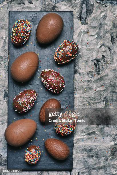chocolate easter eggs on a table top view - chocolate egg stock pictures, royalty-free photos & images