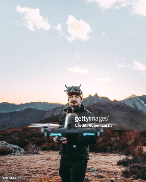 woman hiking with a backpack and her dog with reflection on the water - drone pilot stock pictures, royalty-free photos & images