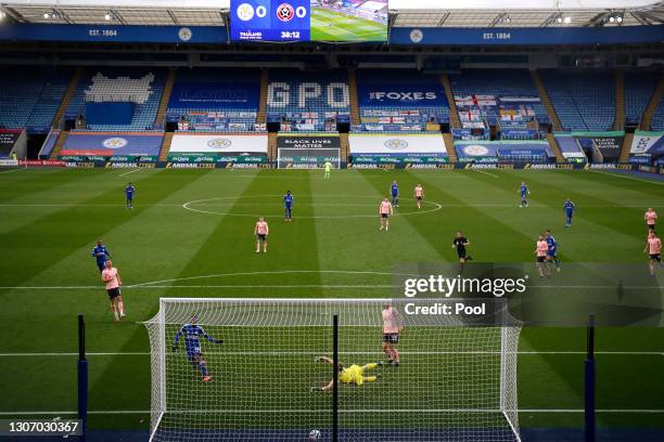 Kelechi Iheanacho of Leicester City scores their side's first goal past Aaron Ramsdale of Sheffield United during the Premier League match between...
