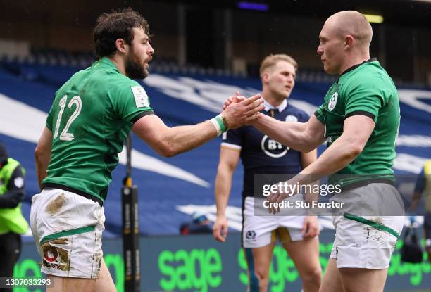 Robbie Henshaw of Ireland celebrates with team mate Keith Earls after scoring their side's first try during the Guinness Six Nations match between...