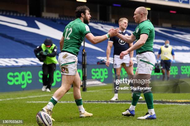 Robbie Henshaw of Ireland celebrates with team mate Keith Earls after scoring their side's first try during the Guinness Six Nations match between...