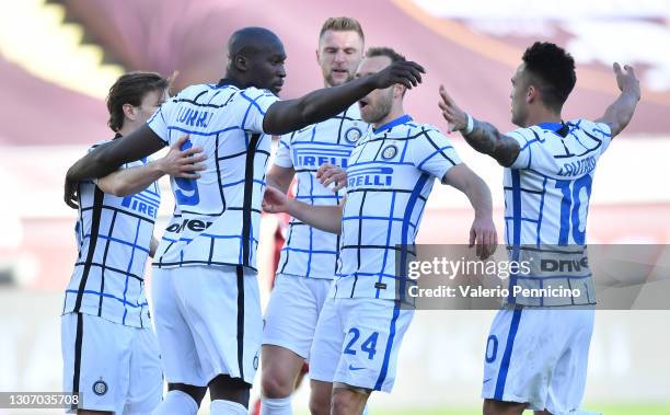 Romelu Lukaku of Internazionale celebrates with team mates Christian Eriksen and Lautaro Martinez after scoring their side's first goal from the...