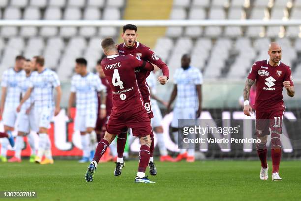 Antonio Sanabria of Torino FC celebrates with Vojnovic Lyanco after scoring their side's first goal during the Serie A match between Torino FC and FC...