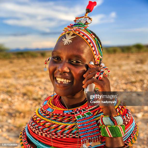 african woman from samburu tribe using mobile phone, kenya, africa - a beautiful masai woman imagens e fotografias de stock