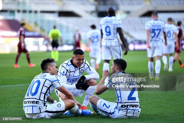 Lautaro Martinez of Internazionale celebrates with team mates Alexis Sanchez and Achraf Hakimi after scoring their side's second goal during the...