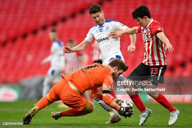 Lee Burge of Sunderland makes a save from David Nugent of Tranmere Rovers during the Papa John's Trophy Final match between Sunderland and Tranmere...
