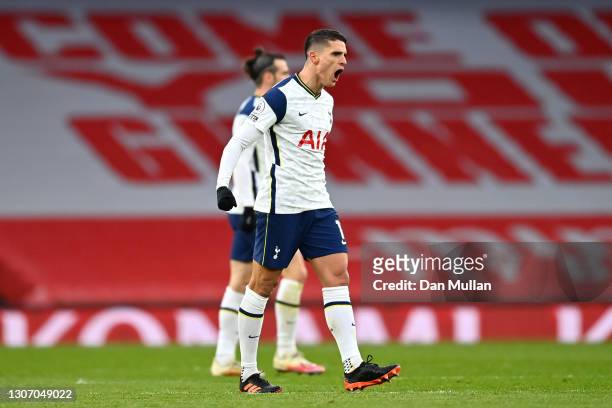 Erik Lamela of Tottenham Hotspur celebrates after scoring their side's first goal during the Premier League match between Arsenal and Tottenham...