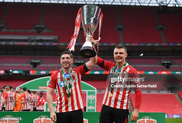 Lynden Gooch and Max Power of Sunderland celebrate with the Papa John's Trophy after the Papa John's Trophy Final match between Sunderland and...