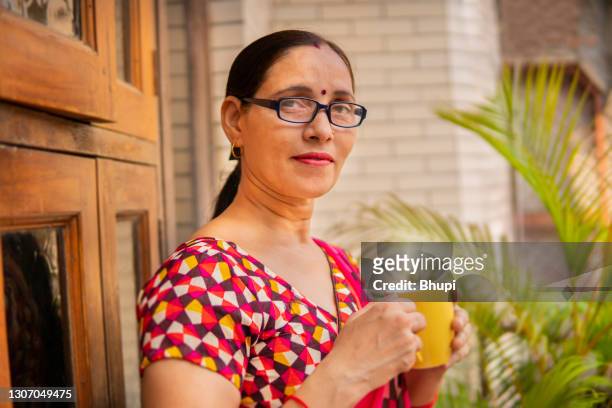 Mature Woman Potted Plant Photos And Premium High Res Pictures Getty
