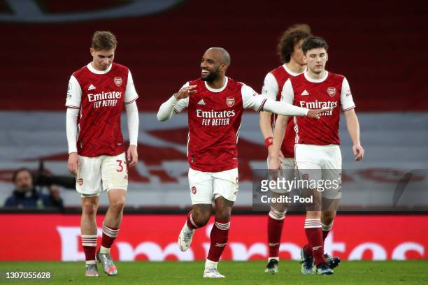 Alexandre Lacazette of Arsenal celebrates with Emile Smith Rowe after scoring their side's second goal from the penalty spot during the Premier...